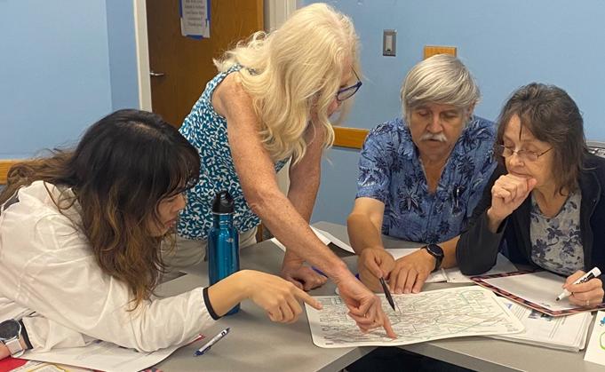 A group of students studying a map