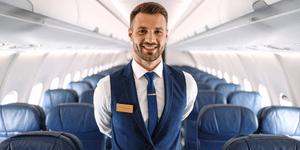 Male flight attendant on a plane