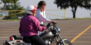 Woman Instructor with a female Motorcycle rider