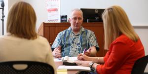 two women and a man in domestic mediation training