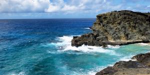 A cove with rugged cliffs and ocean waves