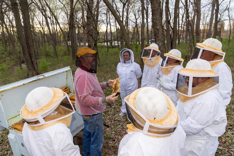 A beekeeping instructor leading the class